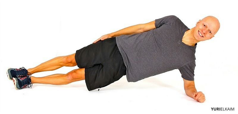 Yuri Elkaim doing a side plank