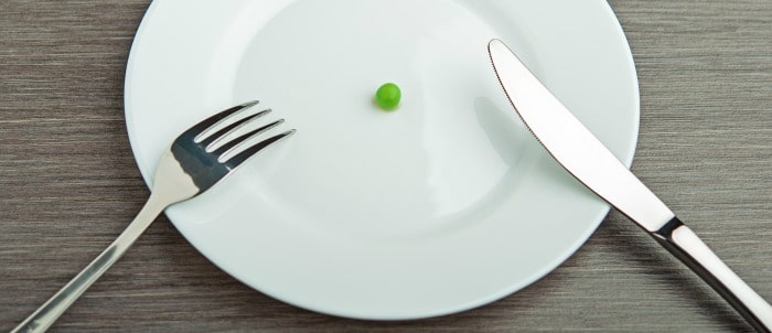 Empty plate with a pea on it