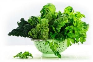 Colander of dark leafy greens