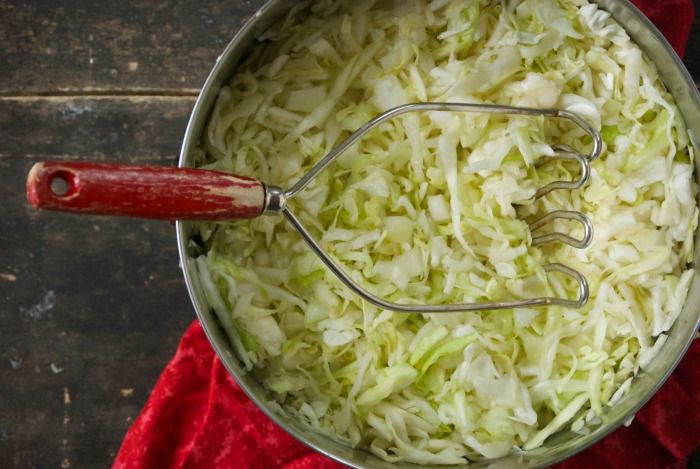 Cabbage being fermented in a bowl