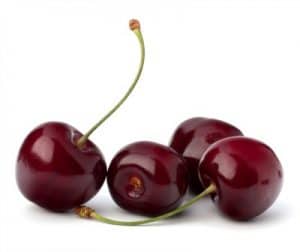 Four cherries with a white background