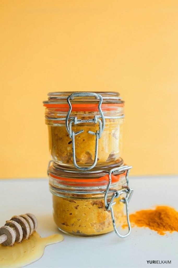Stacked jars of turmeric face mask