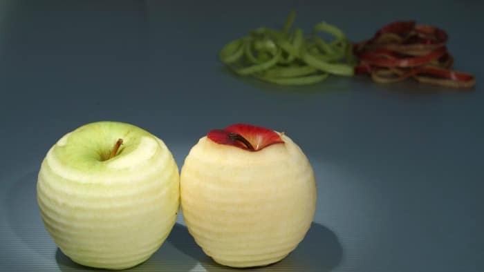 Two apples with skins peeled