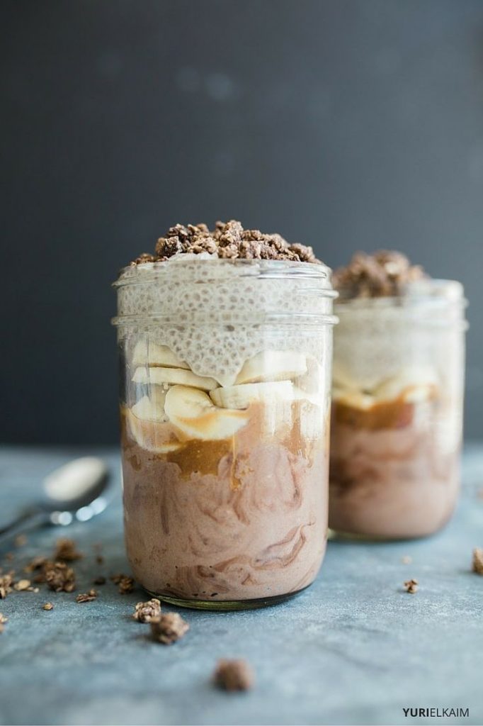 Two mason jars of chocolate chia pudding parfait