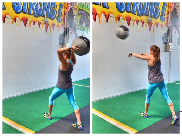 Woman soccer throwing a medicine ball