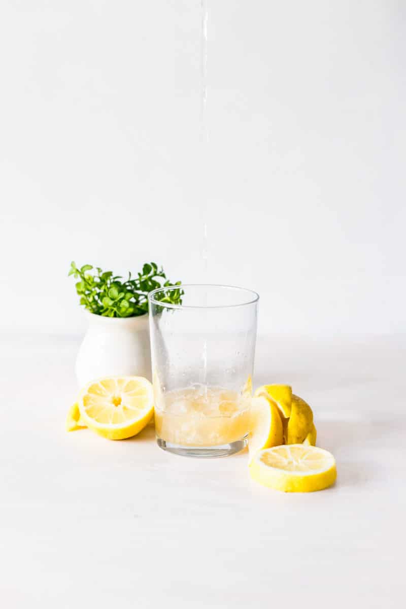 Sliced Lemons with a Glass of Lemon Water 