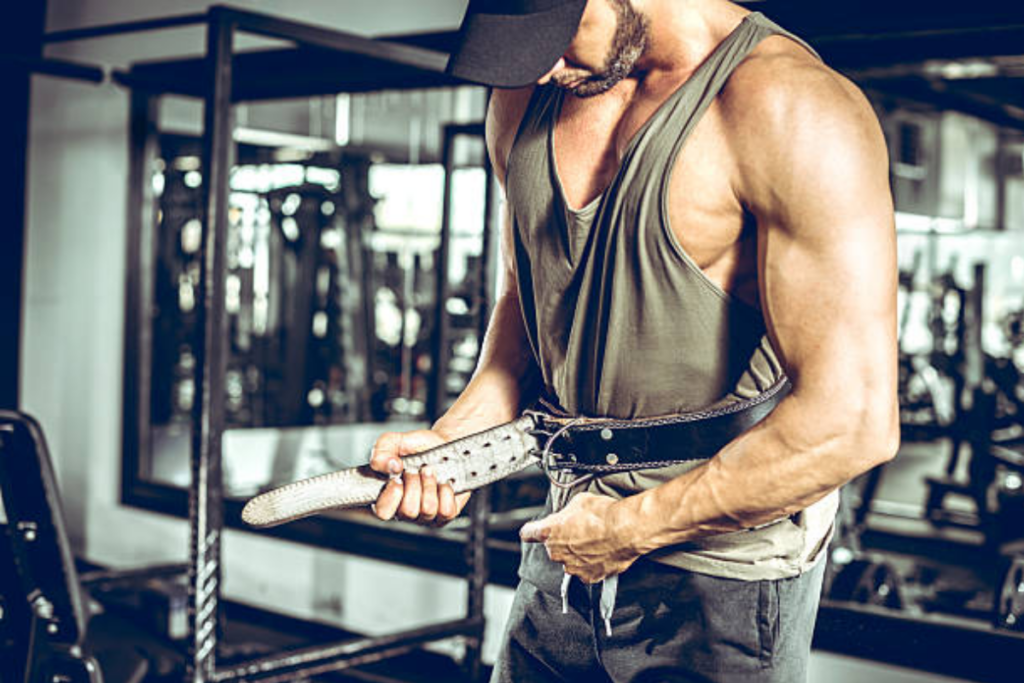 Adult bodybuilder wearing leather gym protection belt. Image source: iStock by Getty Images