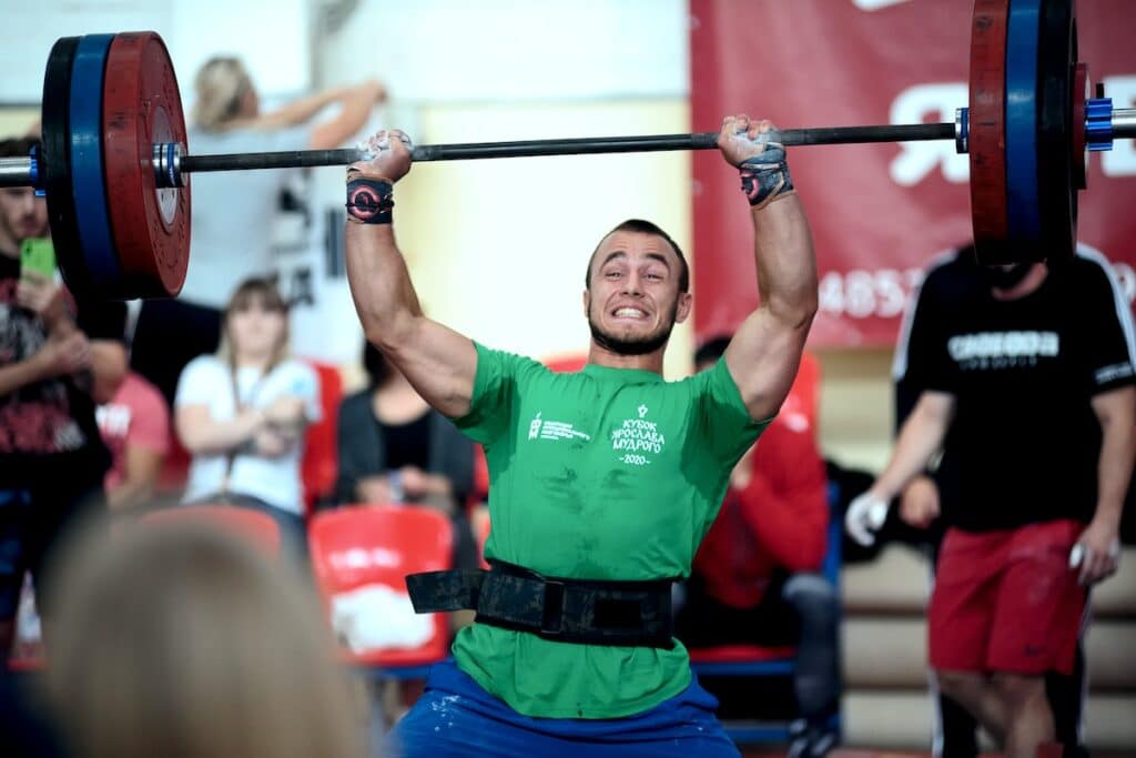 Image of a weightlifter with lifting belts. Image source: Pexels