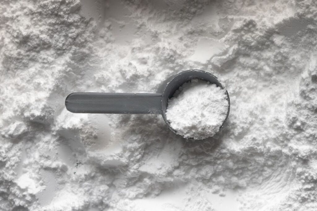 Image of creatine powder in a scoop. Image source: Unsplash