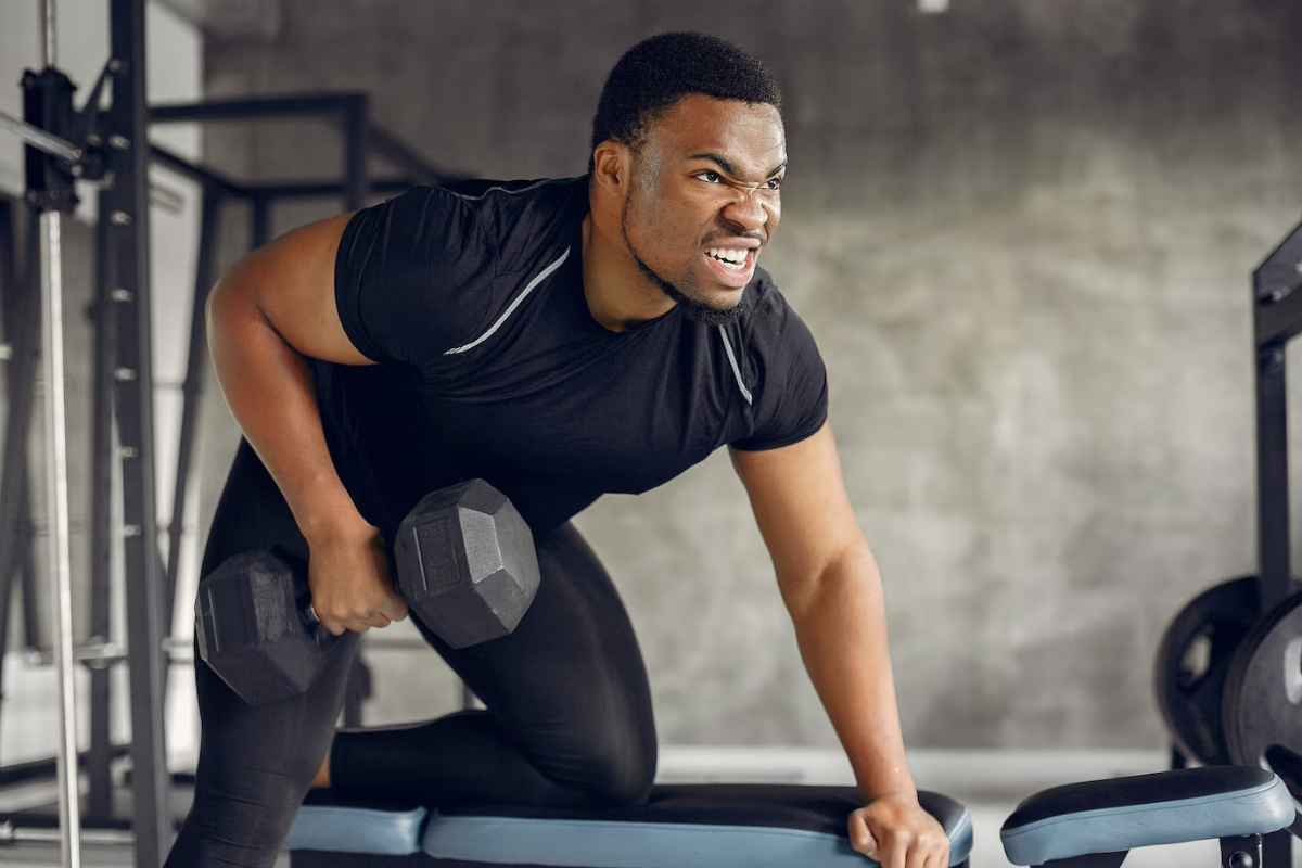 handsome black man is engaged in a gym. Image source: freepik