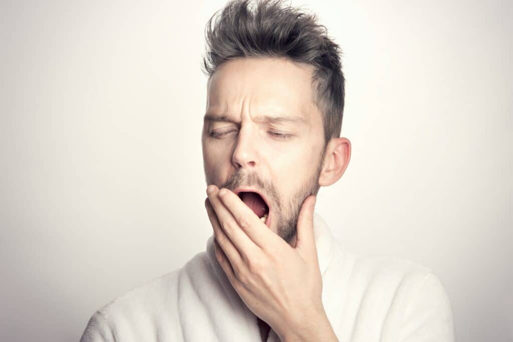 Image of a man yawning. Source: pexels