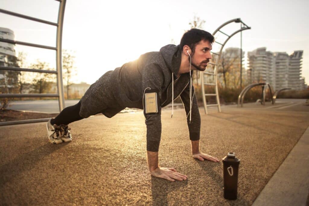 Image of a man doing push ups. Source: pexels